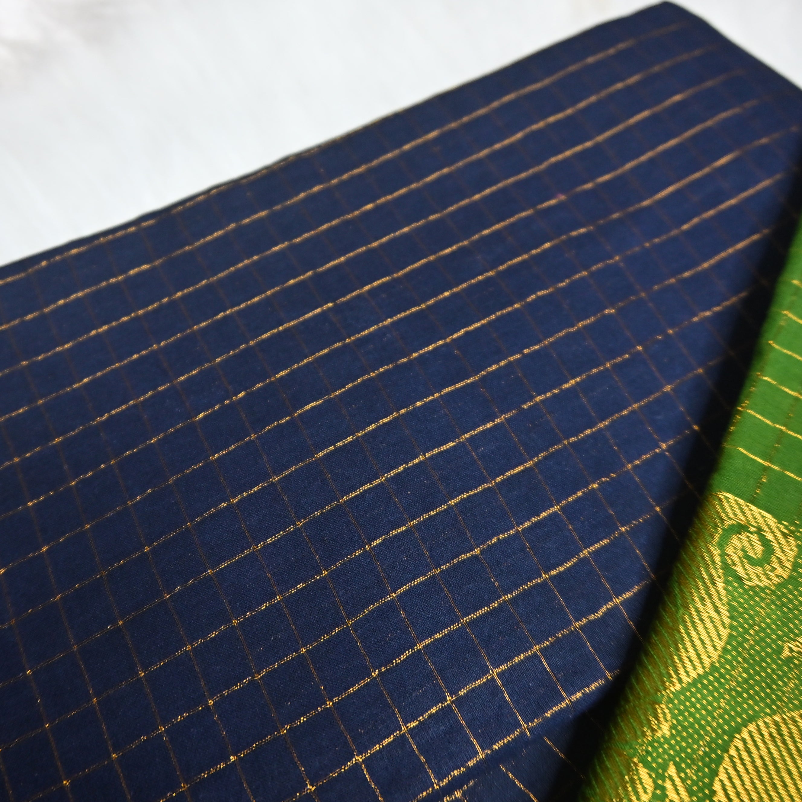 Pentex Madurai Sungudi saree in a green and blue combination.
