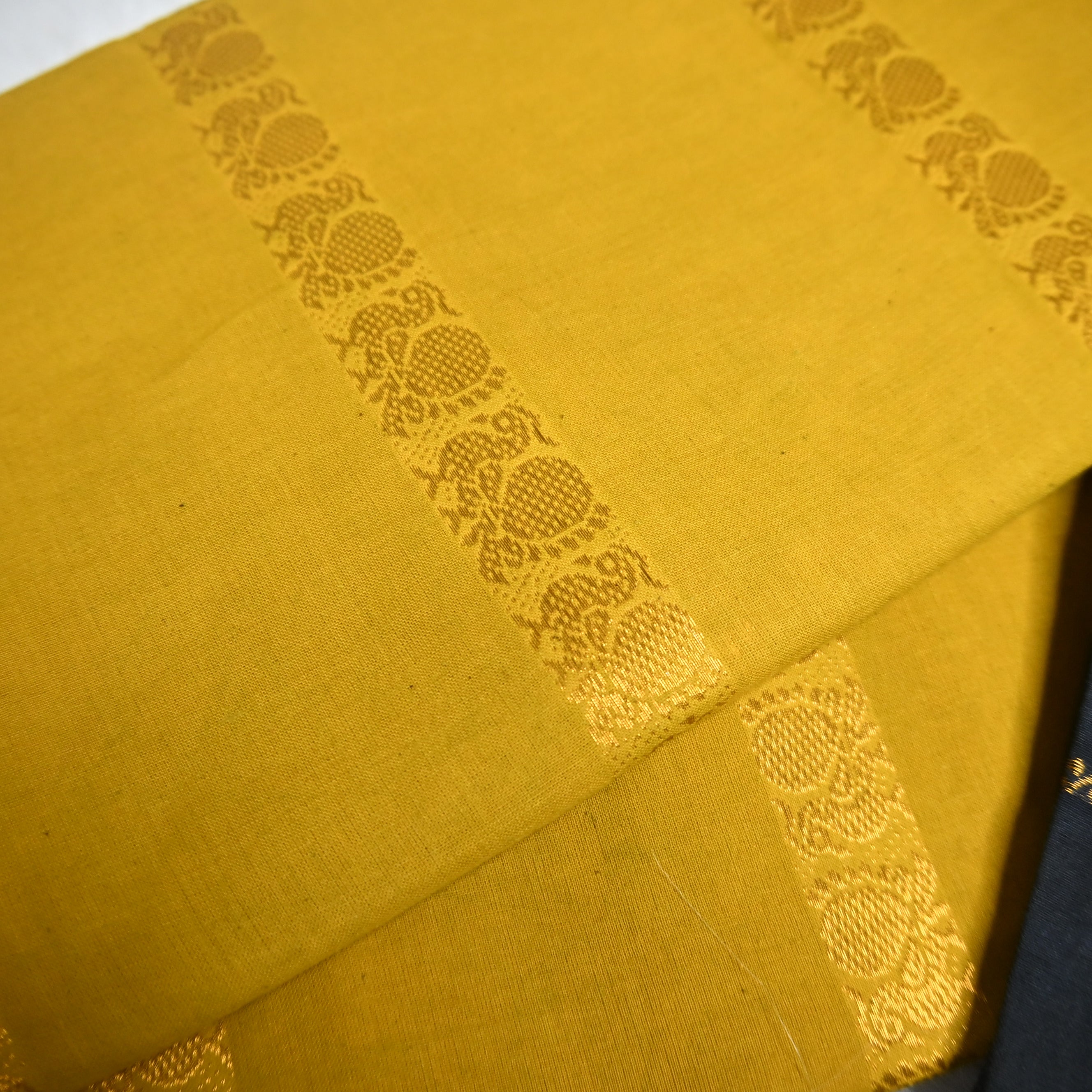 mustard yellow and Black Velthari Madurai Sungudi cotton saree.
