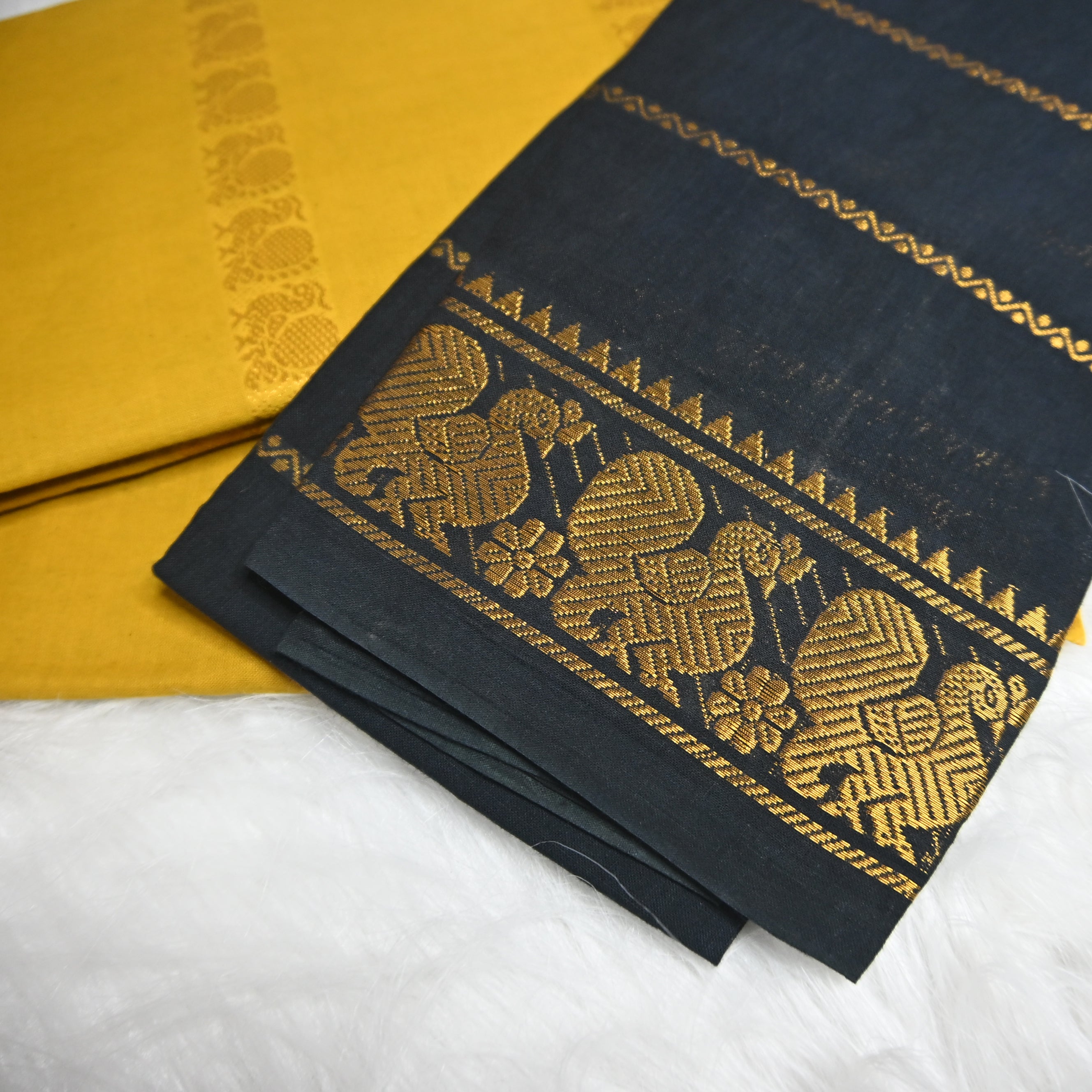 mustard yellow and Black Velthari Madurai Sungudi cotton saree.