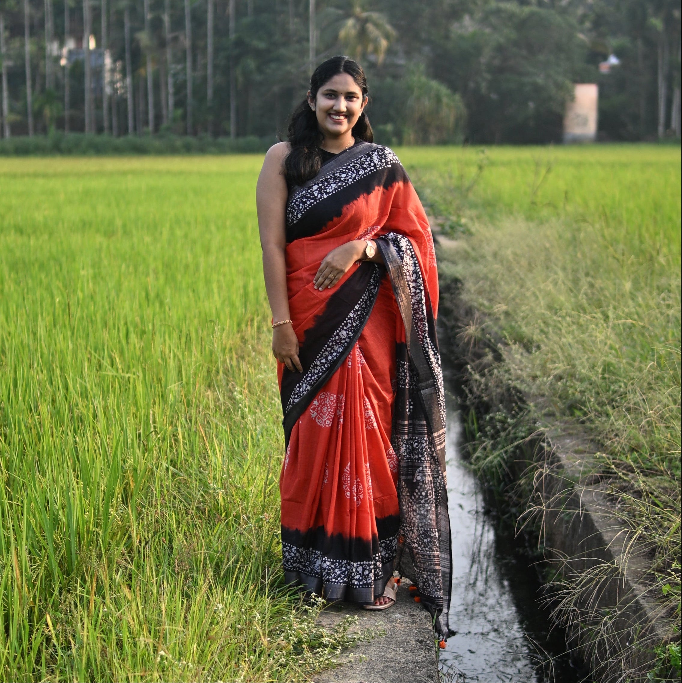 Linen Batik Orange and Black Saree.