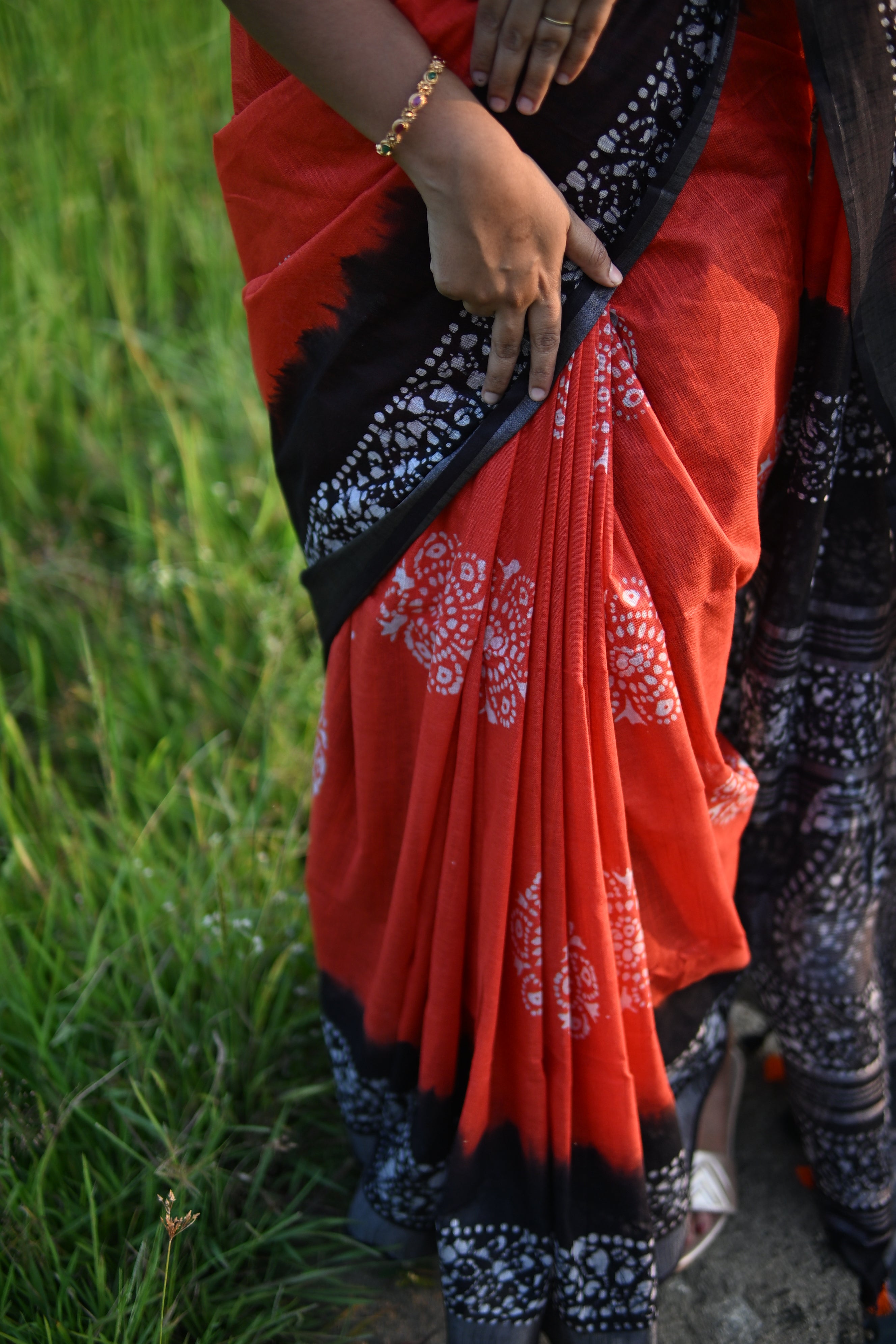 Linen Batik Orange and Black Saree.