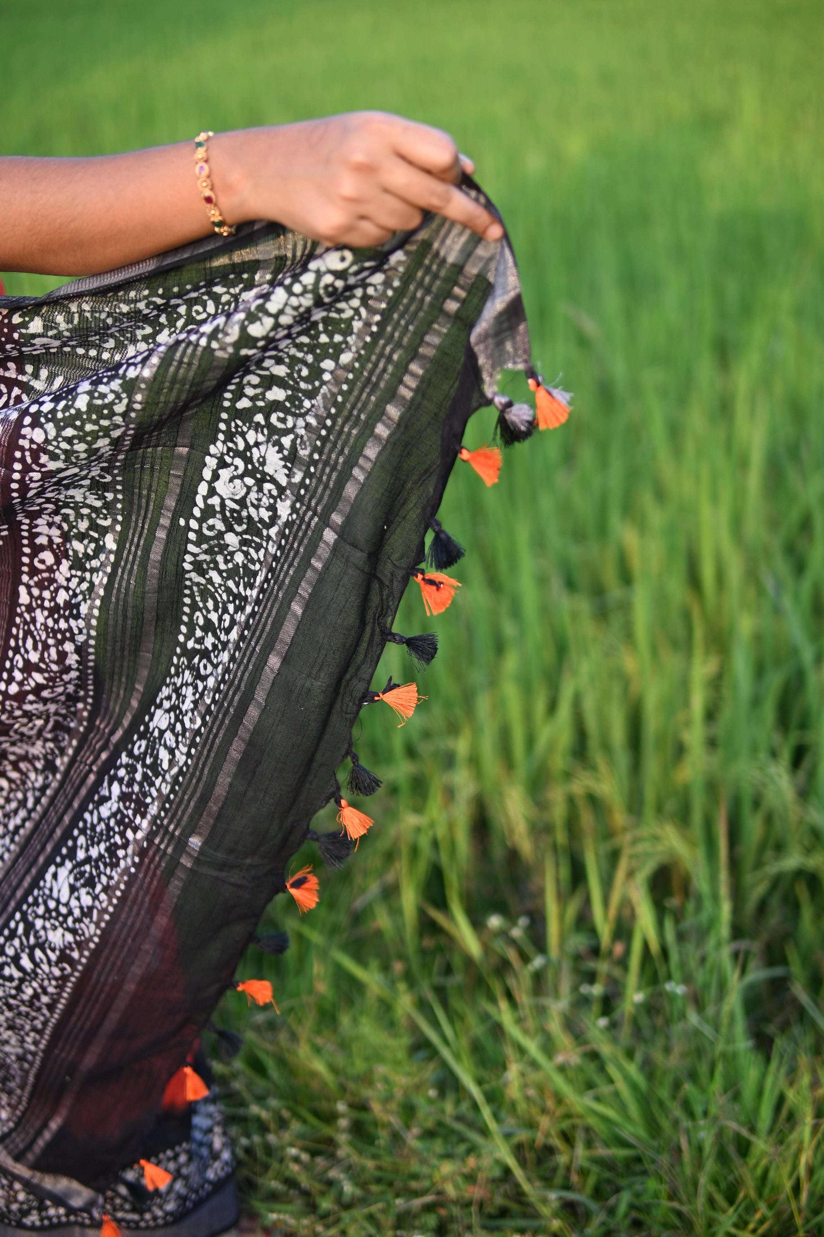Linen Batik Orange and Black Saree.