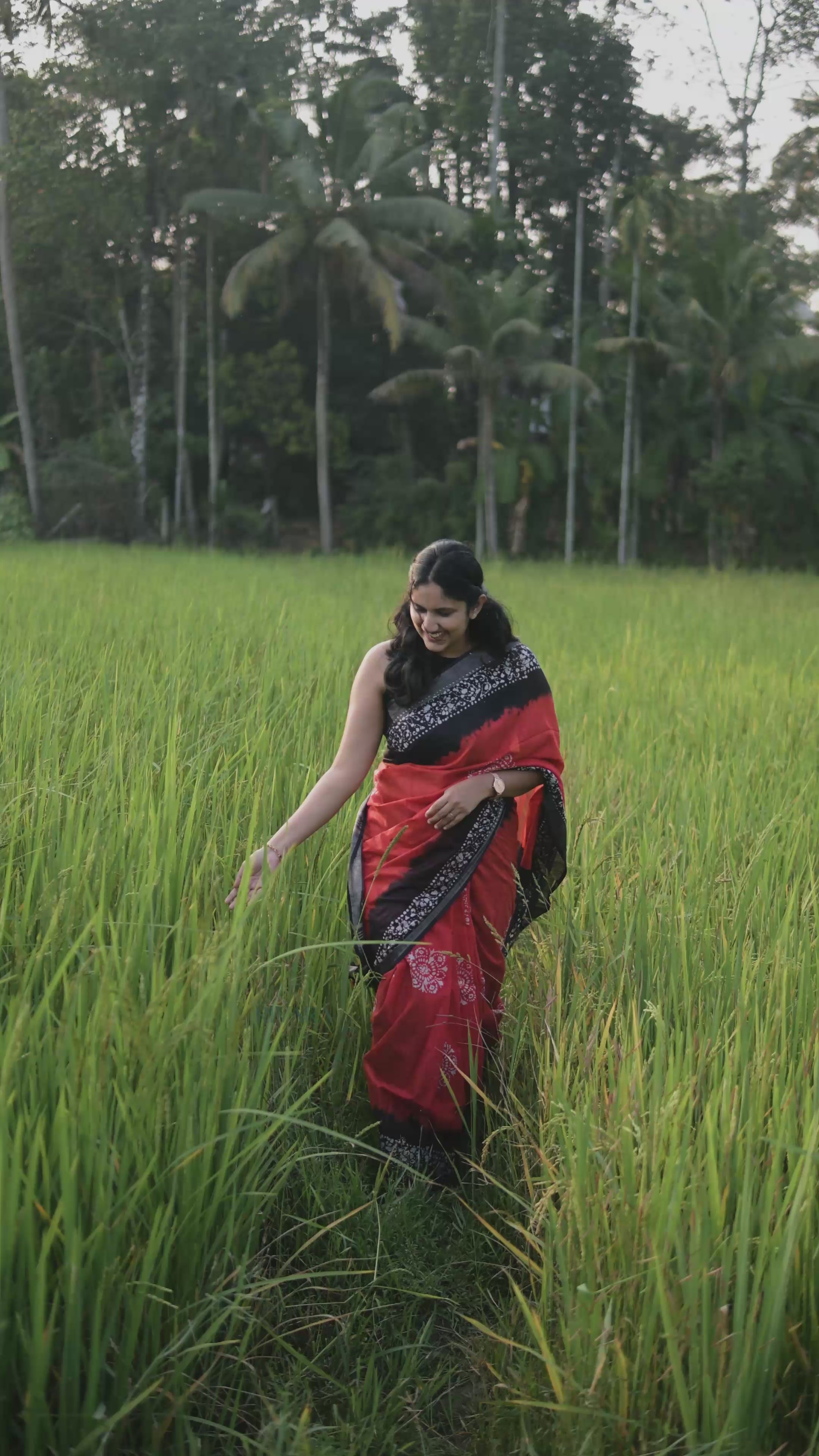 Linen Batik Orange and Black Saree.